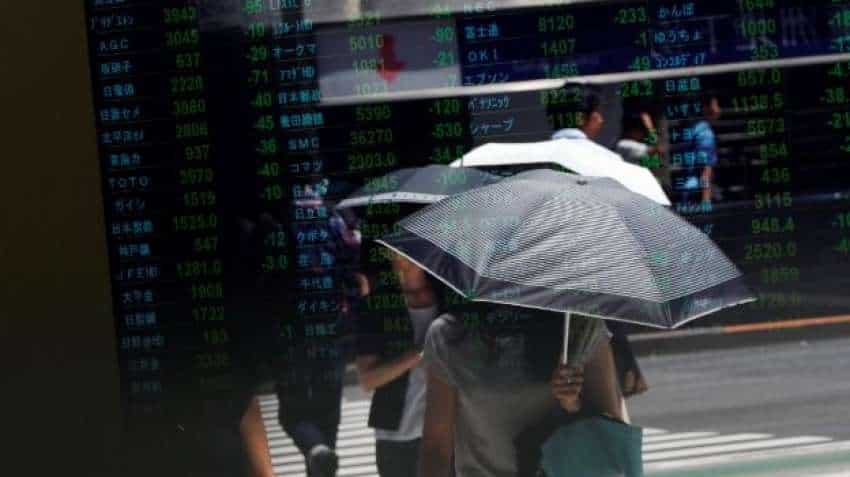 Global Markets: Asia shares try to rally after gut-wrenching week