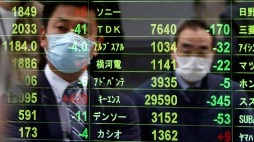 Asia shares suffer fresh spill as virus damage deepens