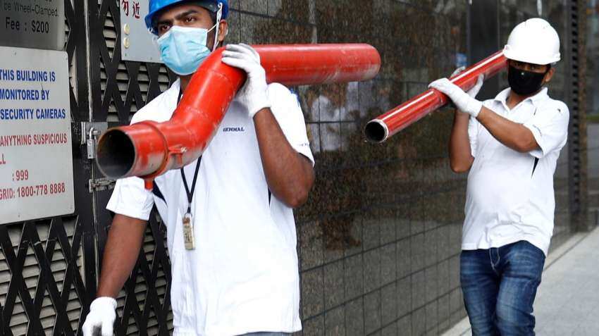 Singapore quarantines migrant workers in virus fight