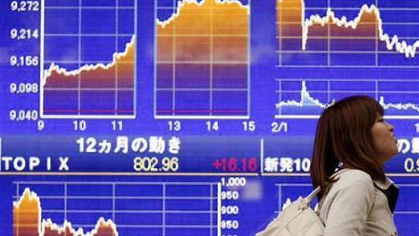 Global Markets: Asia shares make cautious gains, oil and gold jump