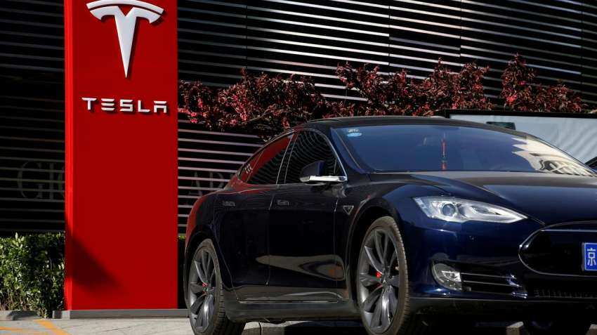 Tesla shares surpass record $1,000 mark for first time