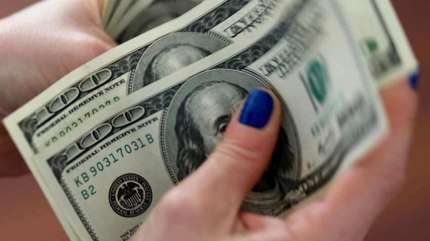 US dollar climbs amid economic data