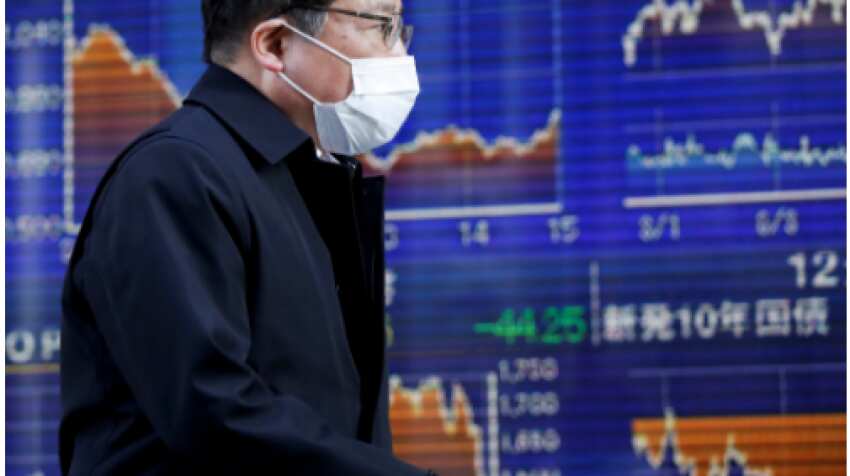 Asian shares slip from all-time highs; oil falls on virus case surge