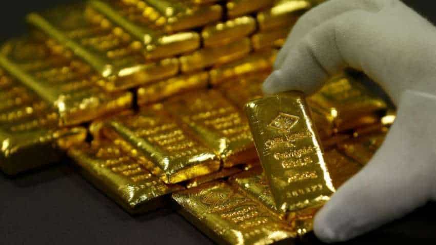 Gold scales two-week high as dollar slips on stimulus optimism