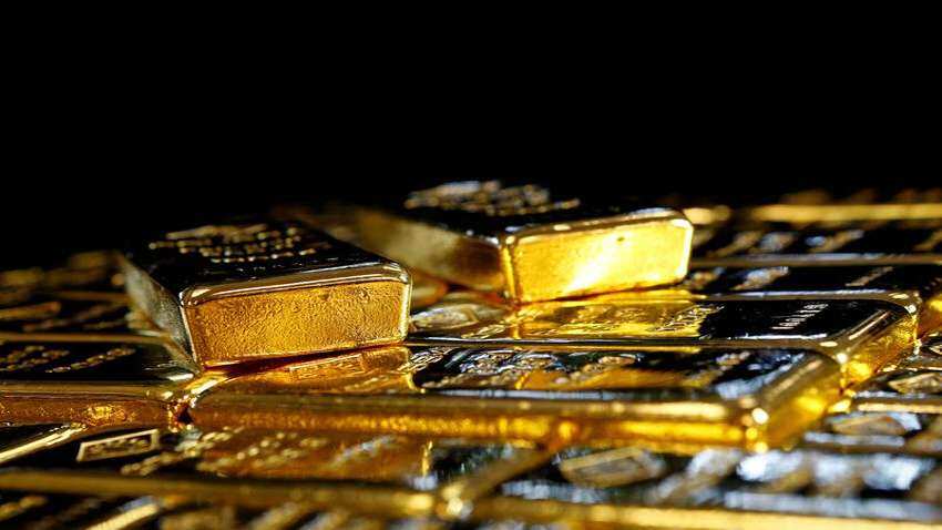 Gold price firms on faltering dollar, stimulus hopes