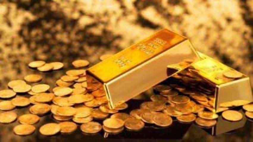 Gold prices down Rs 122, silver up Rs 587