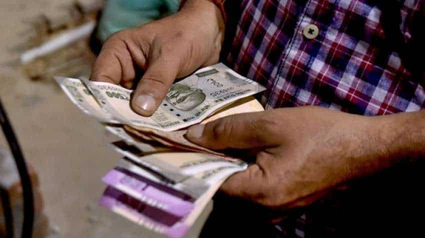 Rupee pares initial losses to close 11 paise up at 74.12 against USD