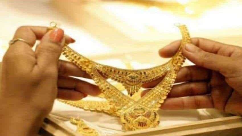Gold Price Today: Yellow metal trades flat above Rs 49,000; buy on dips, say experts