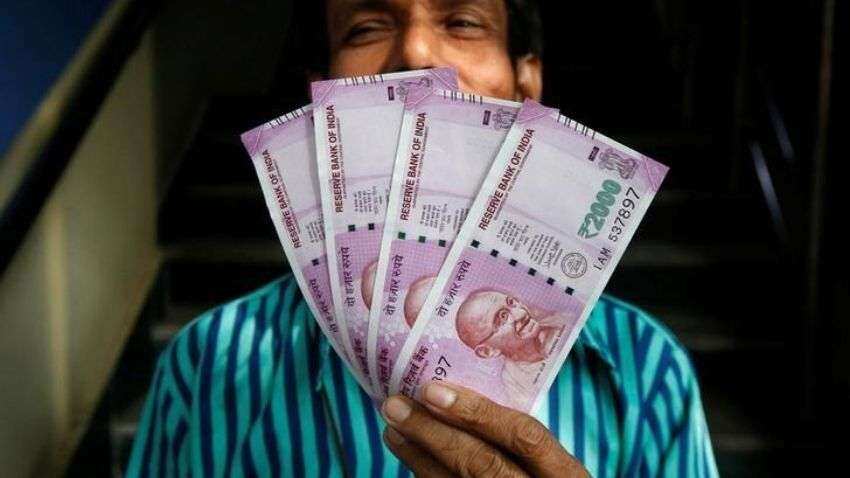 Rupee slips 5 paise to close at 74.79 against US dollar | Zee Business
