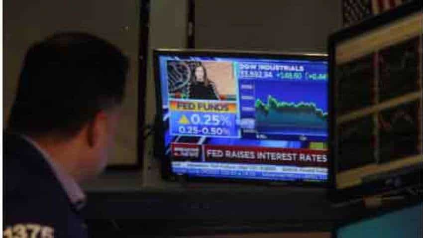 Fed hikes rate by quarter percentage point; Wall Street stocks, U.S. yields rise