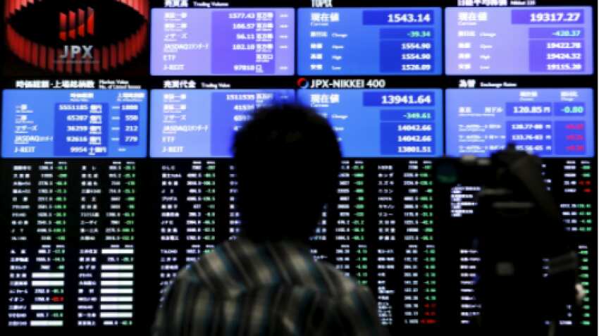 Asian shares trim weekly losses, dollar steady near 20-year highs