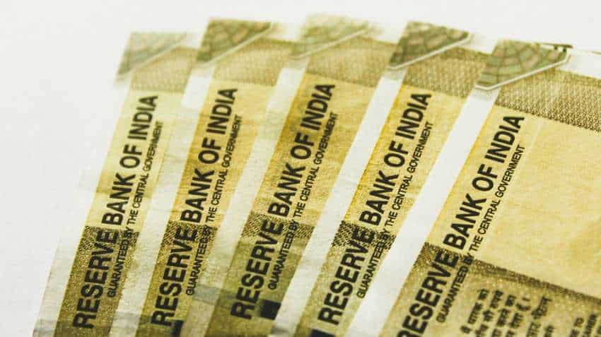 Rupee skids 17 paise to record low of 77.61 against USD