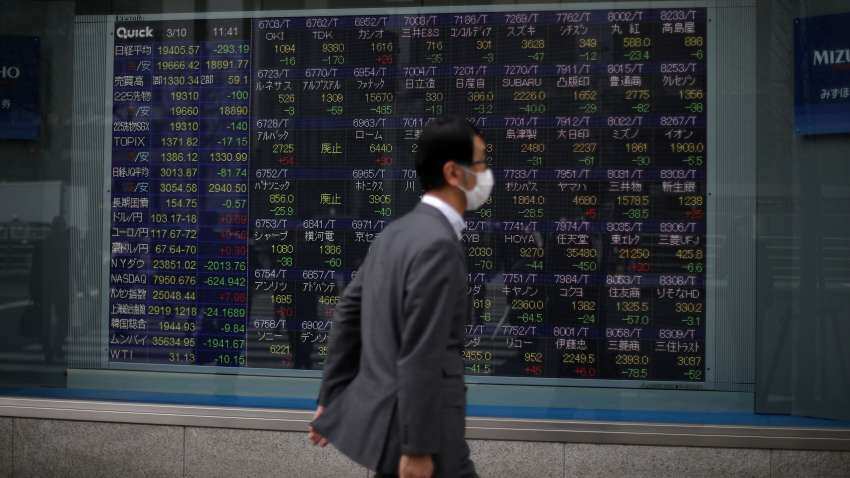 Asian stocks choppy as US inflation slows and dollar drops; Hong Kong shares down nearly 1%
